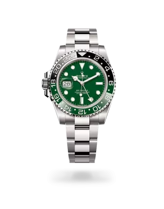 Rolex GMT-Master II in white gold with a green ceramic dial, bidirectional rotatable 24-hour graduated  bezel, and Oyster bracelet - Gandelman